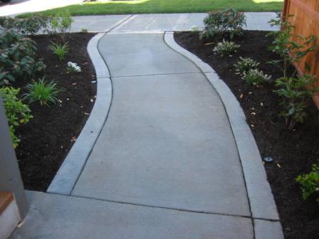 Broom-finished concrete driveway with border