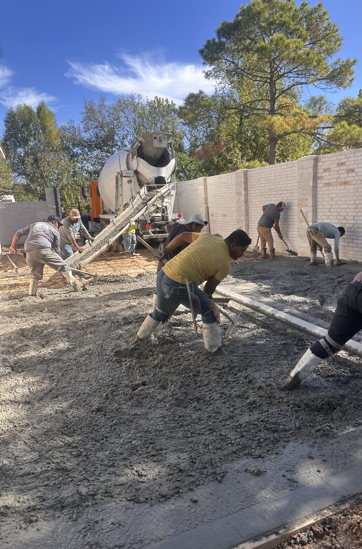 Coronado Exteriors crew pouring concrete
