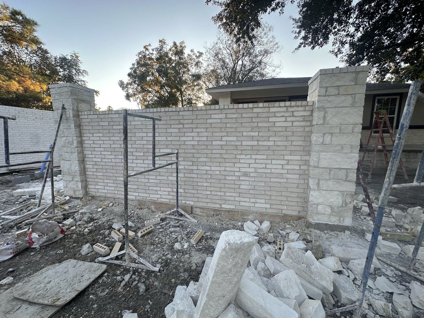 Coronado Exteriors building a stone wall