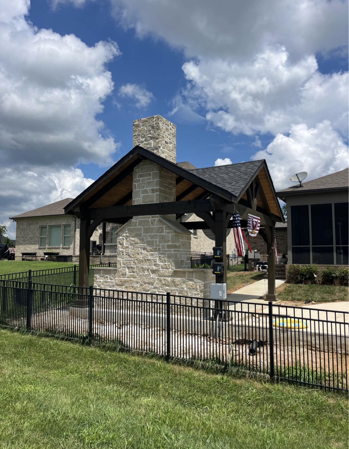 Custom stone fireplace and pavilion by Coronado Exteriors