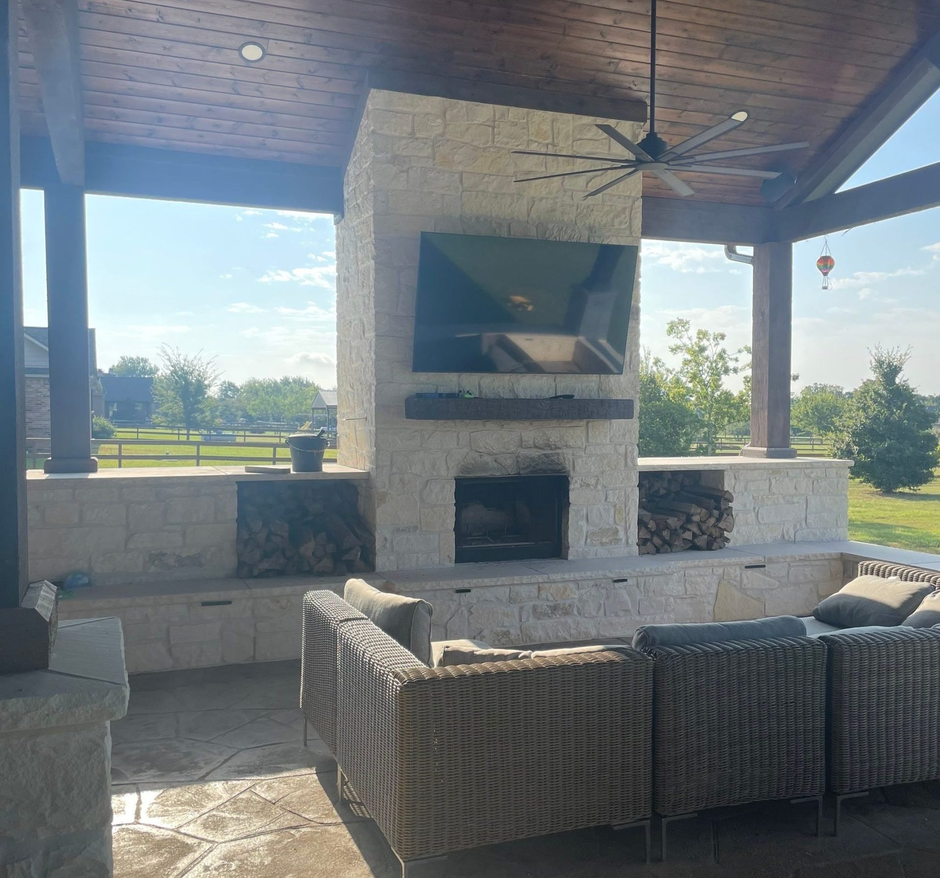 Covered patio matched to home exterior by Coronado Exteriors